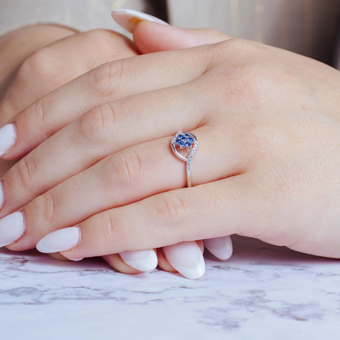 925 Sterling Silver Rhodium Plated Wave Blue Center Flower CZ Ring