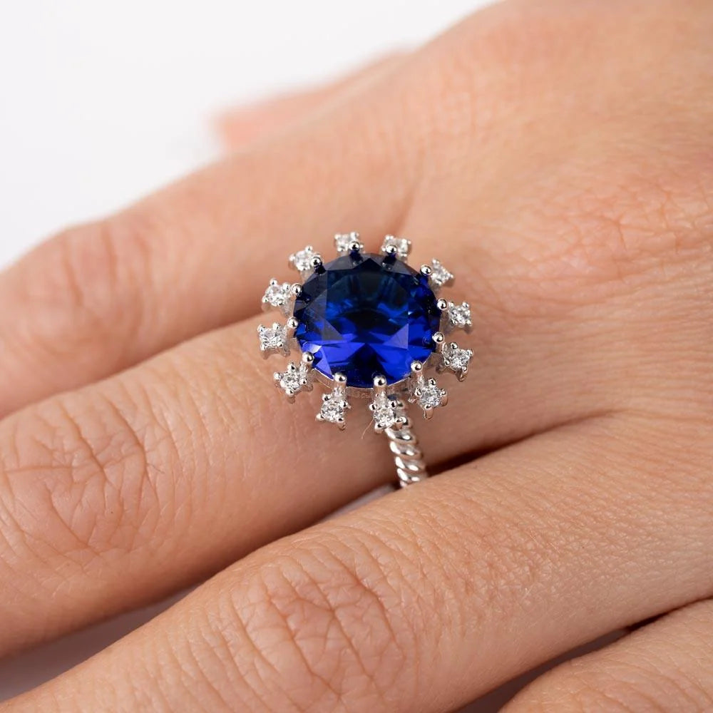 925 Sterling Silver Rhodium Plated Blue Center Flower CZ Ring with Rope Band