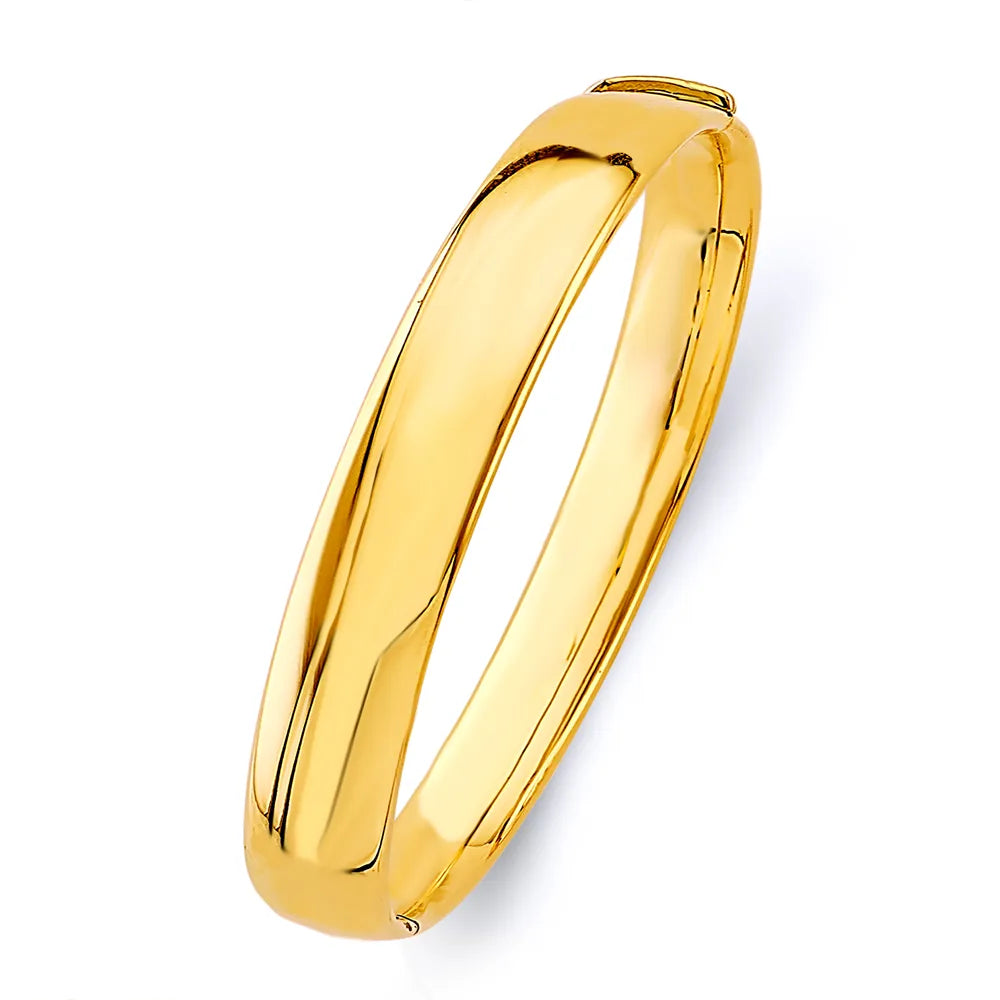 14K Yellow Gold Hollow High Polish Crossover Design Women’s Bangle Size 7"